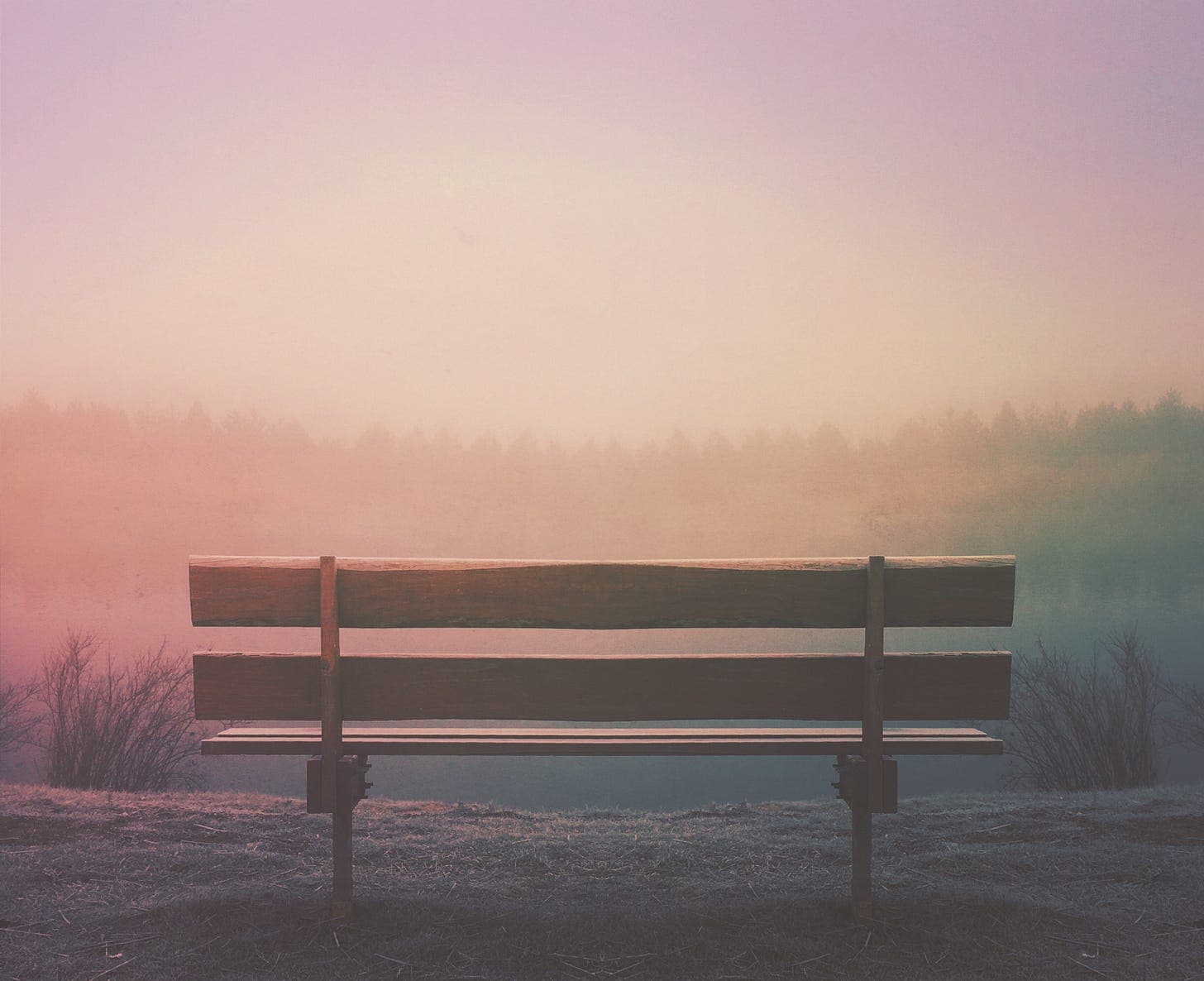 bench in front of sunset